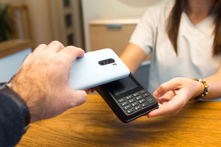 Man using a smartphone to pay